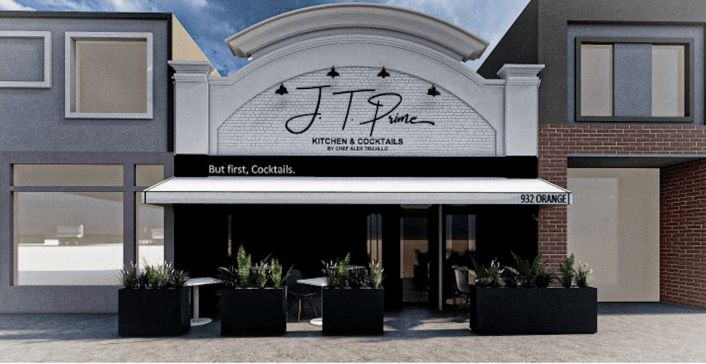 A modern restaurant exterior features a white facade with “J.T. Prime” signage, black awning reading “But first, Cocktails.”, outdoor tables with planters, and the address “932 Orange” visible on the right.